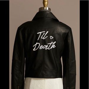 Embroidered with "Til Death" in script and embellished with a heart. Almost new